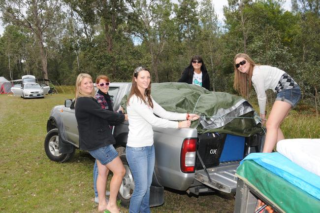 Listening to John Williamson while setting up camp was Jodie Buchanan, Marissa Dyva, Lauren Kennedy, Jessica Palmer and Carly Hanson. Picture: Craig Warhurst