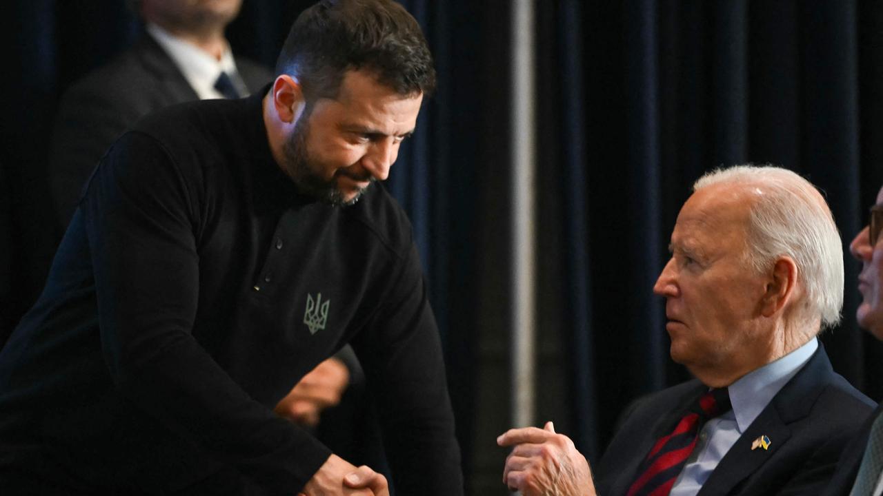 Ukrainian President Volodymyr Zelensky shakes hands with US President Joe Biden. (Photo by ANDREW CABALLERO-REYNOLDS / AFP)