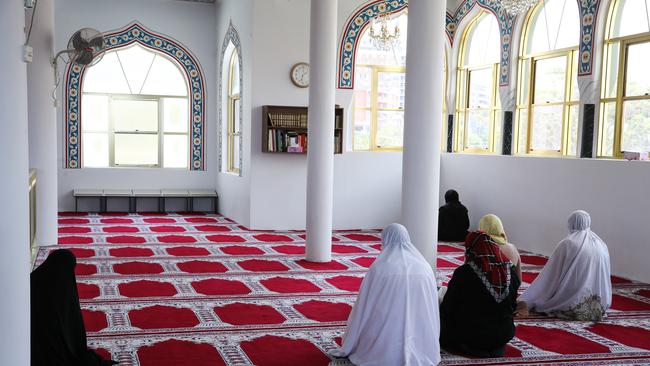 People are seen praying during a service for victims of the Turkey-Syria earthquake at the Auburn Gallipoli Mosque in Sydney. Picture: Gaye Gerard