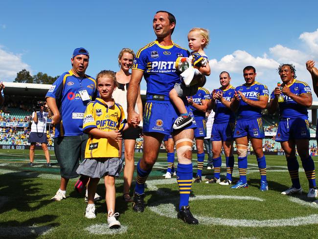 Luke Burt celebrates his 200th game with his family after the Parramatta Eels versus Manly Sea Eagles game at Parramatta Stadium in 2010.