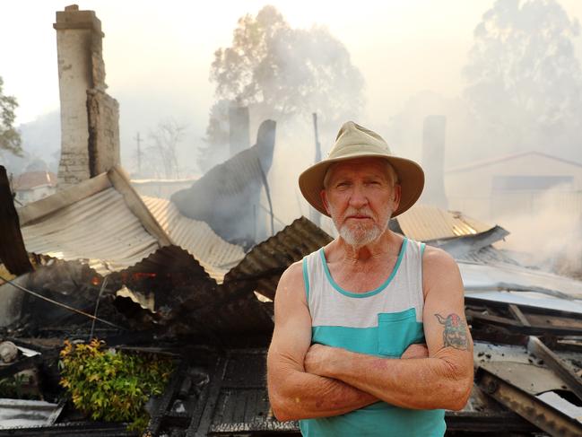 Lithgow resident Pat McFarlane standing in front of the ruins of his home on Crane Road, Lithgow today. Picture: Tim Hunter.