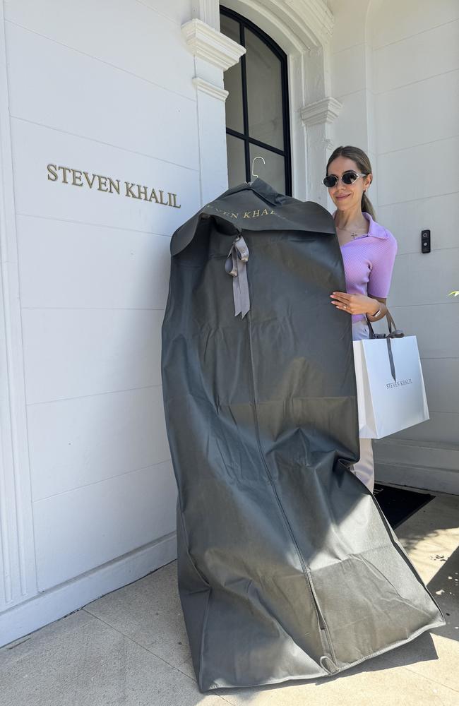 Alexandra Constantine picks up her wedding dress, Picture: Supplied