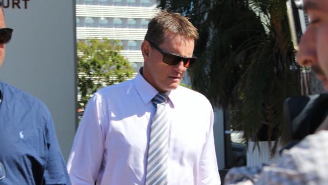 Former NT Police Senior Sergeant Neil Mellon left court through the back door under guard on Tuesday afternoon. Picture: Jason Walls