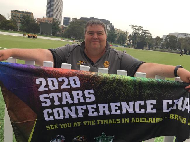 Proud Monash scorer Michael Robinson with the premiership flag.