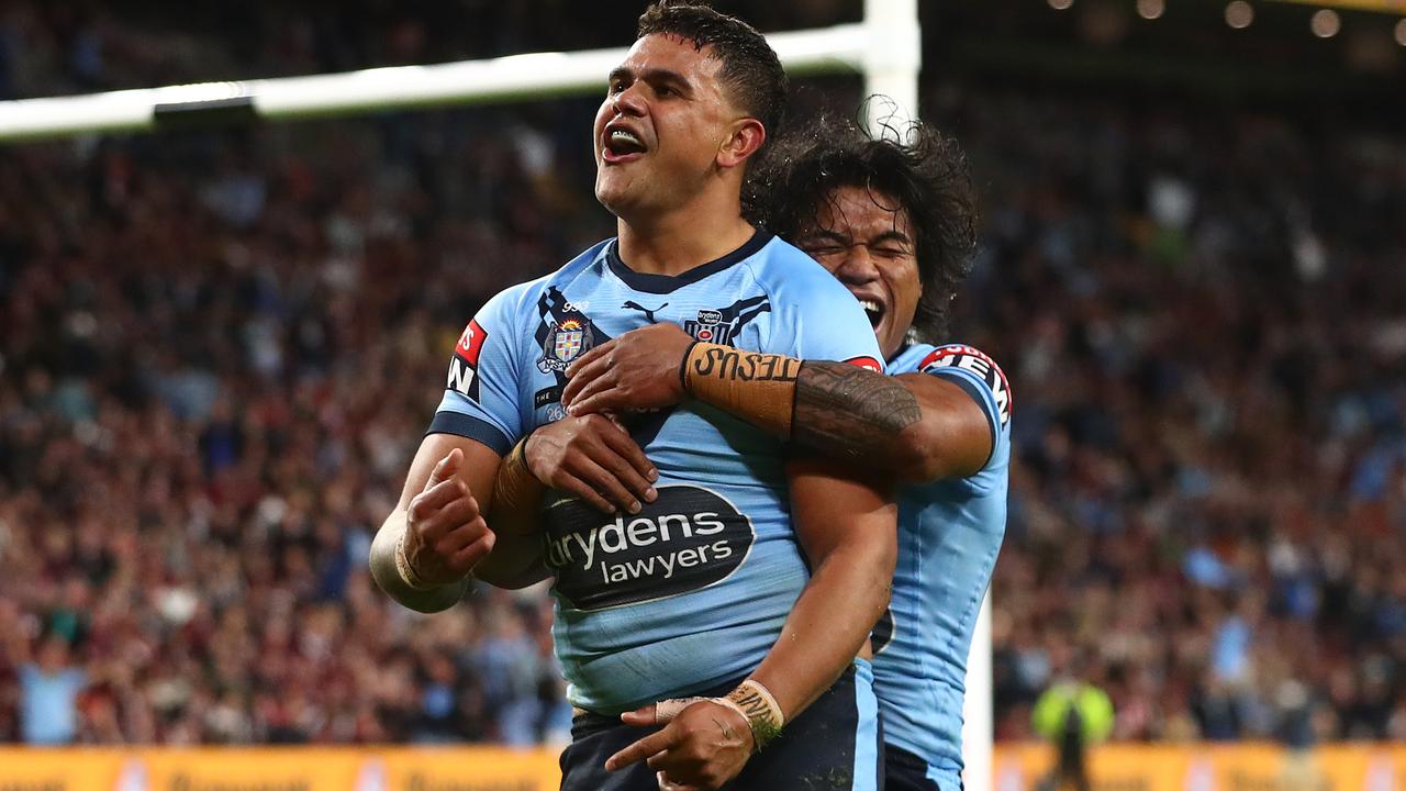 BRISBANE, AUSTRALIA - JUNE 27: Latrell Mitchell of the Blues celebrates after scoring a try with Brian To'o of the Blues during game two of the 2021 State of Origin series between the Queensland Maroons and the New South Wales Blues at Suncorp Stadium on June 27, 2021 in Brisbane, Australia. (Photo by Chris Hyde/Getty Images)