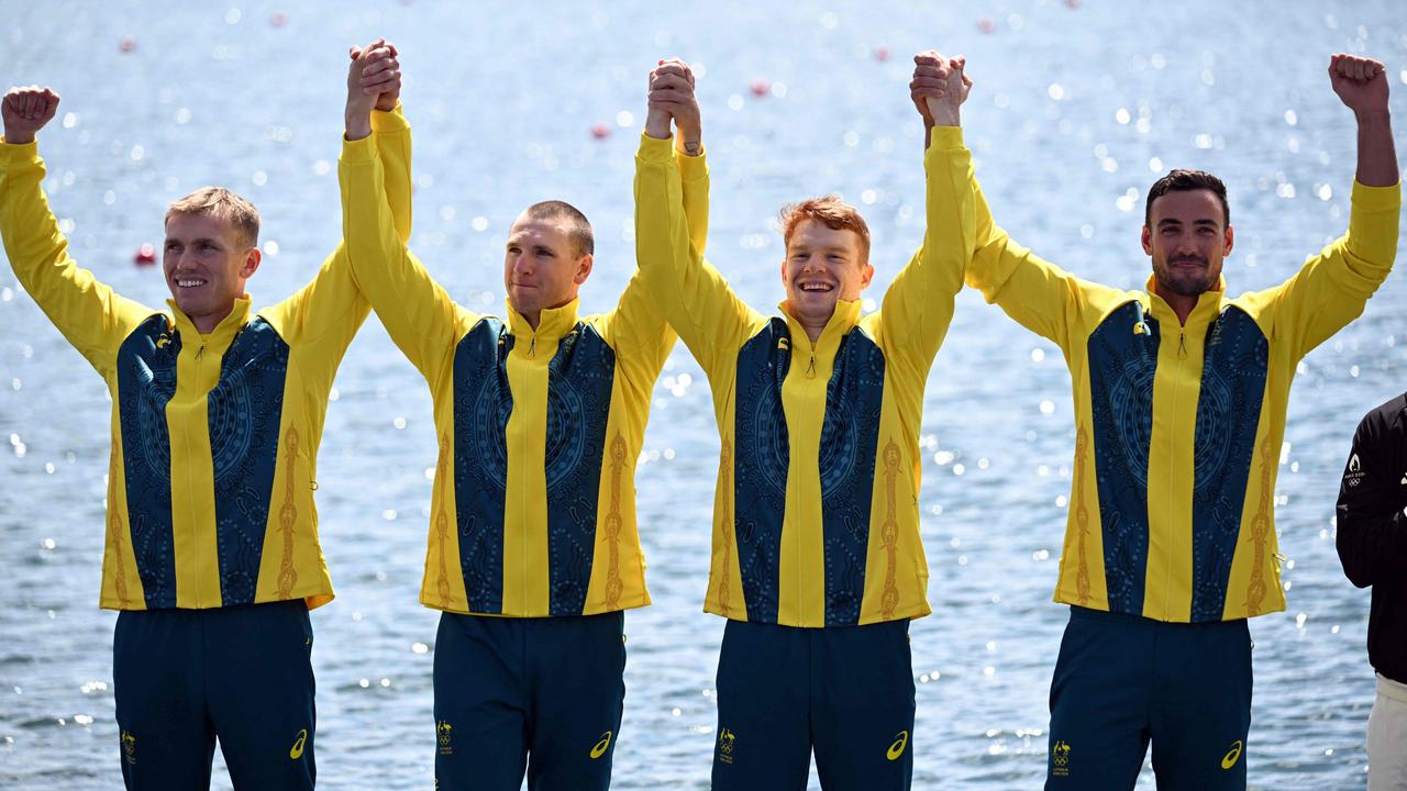 Australia's silver medallists Riley Fitzsimmons, Pierre Van Der Westhuyzen, Jackson Collins and Noah Havard celebrate on the podium.