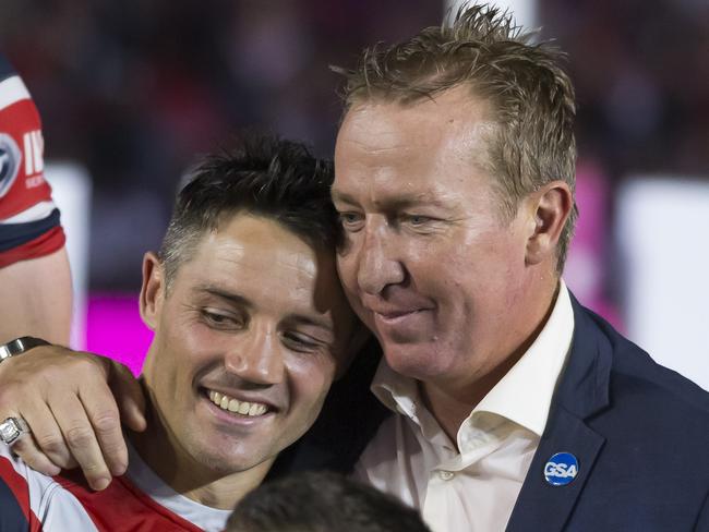 Cooper Cronk of the Roosters with coach Trent Robinson after the 2019 NRL Grand Final between the Canberra Raiders and the Sydney Roosters at ANZ Stadium in Sydney, Sunday, October 6, 2019. (AAP Image/Craig Golding) NO ARCHIVING, EDITORIAL USE ONLY