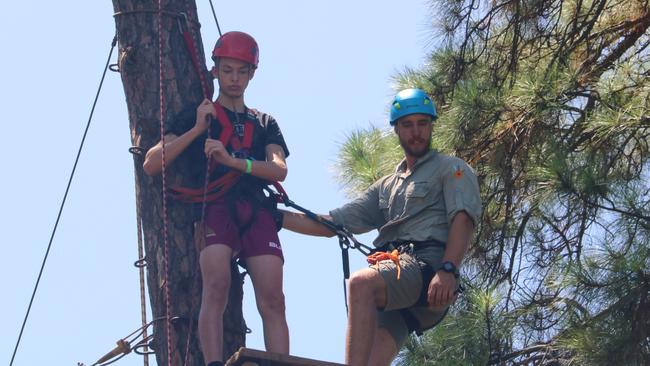 Queensland Conference and Camping Centre instructor Caleb Grant with a student about to complete the Mapleton Leap.