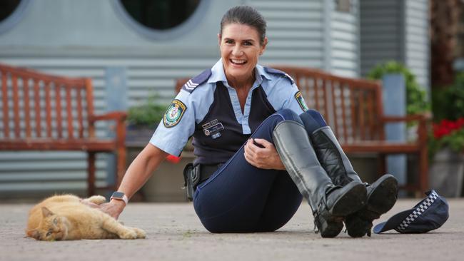 'Troop Cat Ed' with Sergeant Melinda Duncan is one of the hardest workers at the Police Mounted Unit in Redfern. Picture: Liam Driver