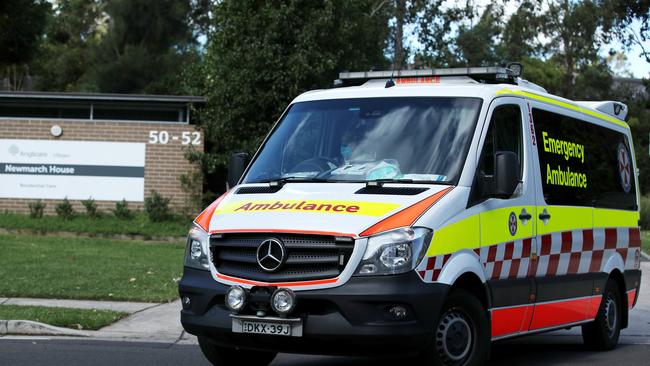 An New South Wales ambulance leaves Newmarch House. Picture: Getty Images