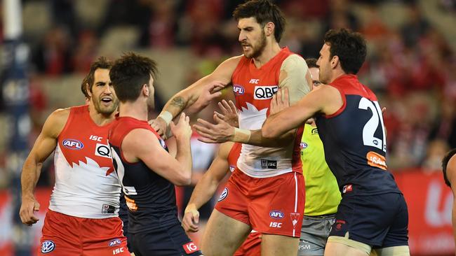 Sydney ruckman Sam Naismith gets stuck into Tom Bugg.