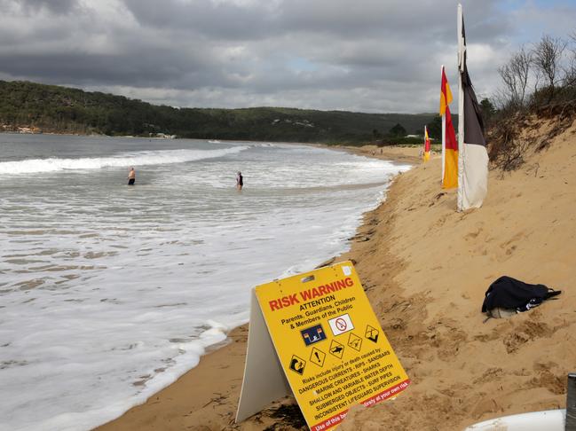 The high tide at Ocean Beach meant lifeguards had to place the flags in the dunes. (AAP image/ Mark Scott)