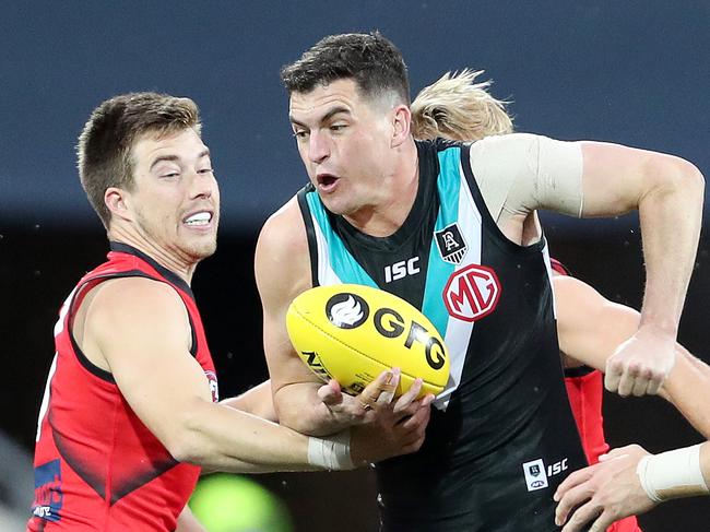 AFL - Saturday, 12th September, 2020 - Port Adelaide v Essendon at the Adelaide Oval. Port Adelaide's Tom Rockliff tries to get past Essendon's Zach Merrett Picture: Sarah Reed