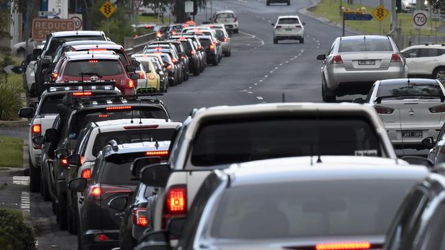 People wait in long queues in their cars at a Covid testing station in Deer Park on Wednesday. Picture: Andrew Henshaw