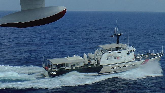 Search continues: A patrol vessel off the coast of Malaysia. Picture: Getty Images