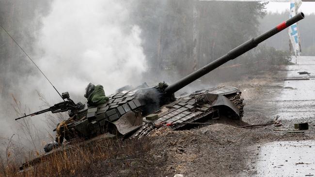 Smoke rises from a Russian tank destroyed by Ukrainian in Lugansk region. Picture: AFP