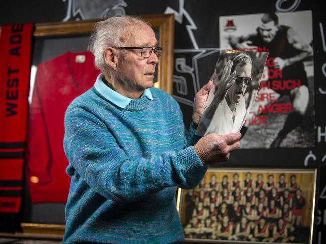 Ted Kerley looks at photographs of his brother, football great Neil Kerley at the West Adelaide Football Club. Picture: Emma Brasier