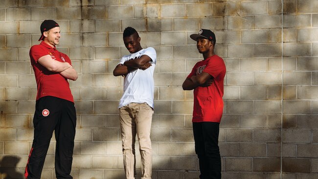 Brendan Hammil and Kwabena Appiah model Western Sydney Wanderers merchandise