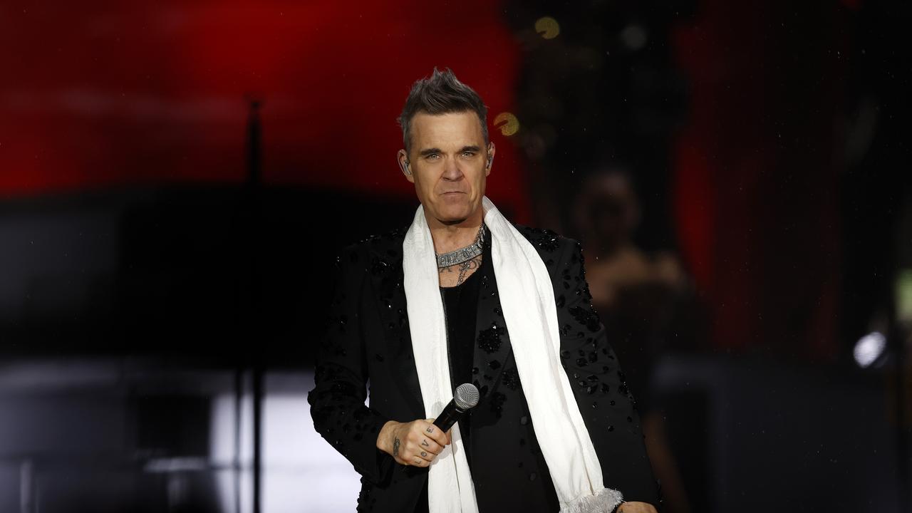 Fan fights for life after fall at Robbie Williams’ Sydney gig | Daily ...