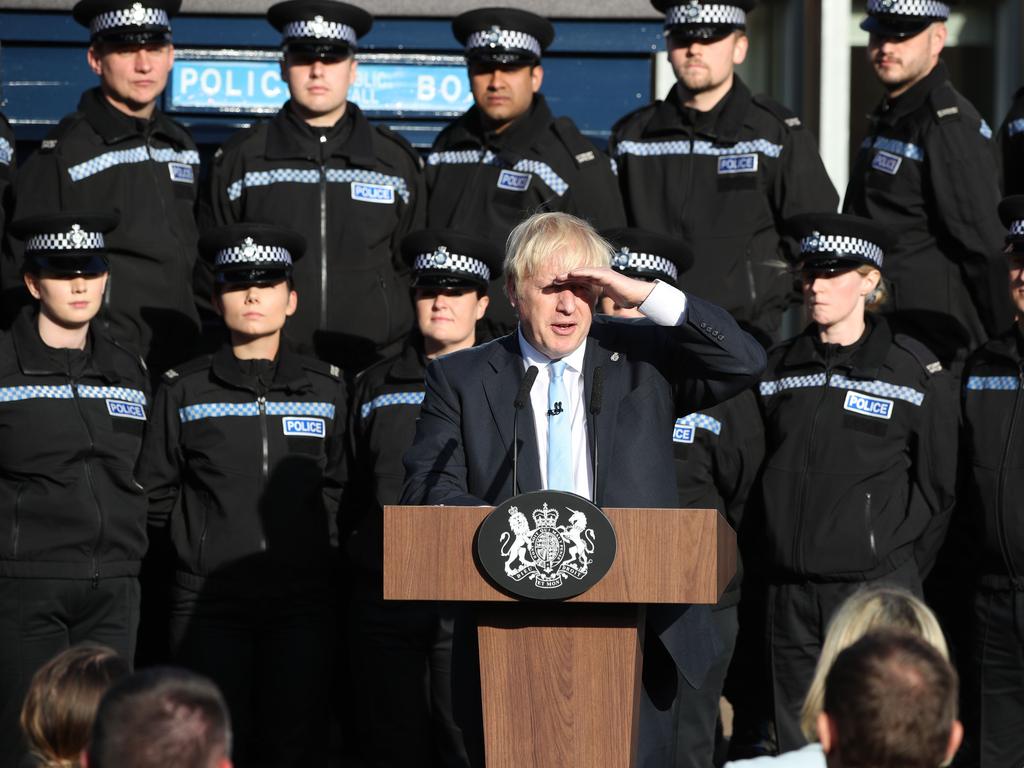 Mr Johnson did a speech with a backdrop of new police recruits that led to widespread criticism politicising the police and mimicking a Trump-style rally. Picture: Danny Lawson / POOL / AFP.