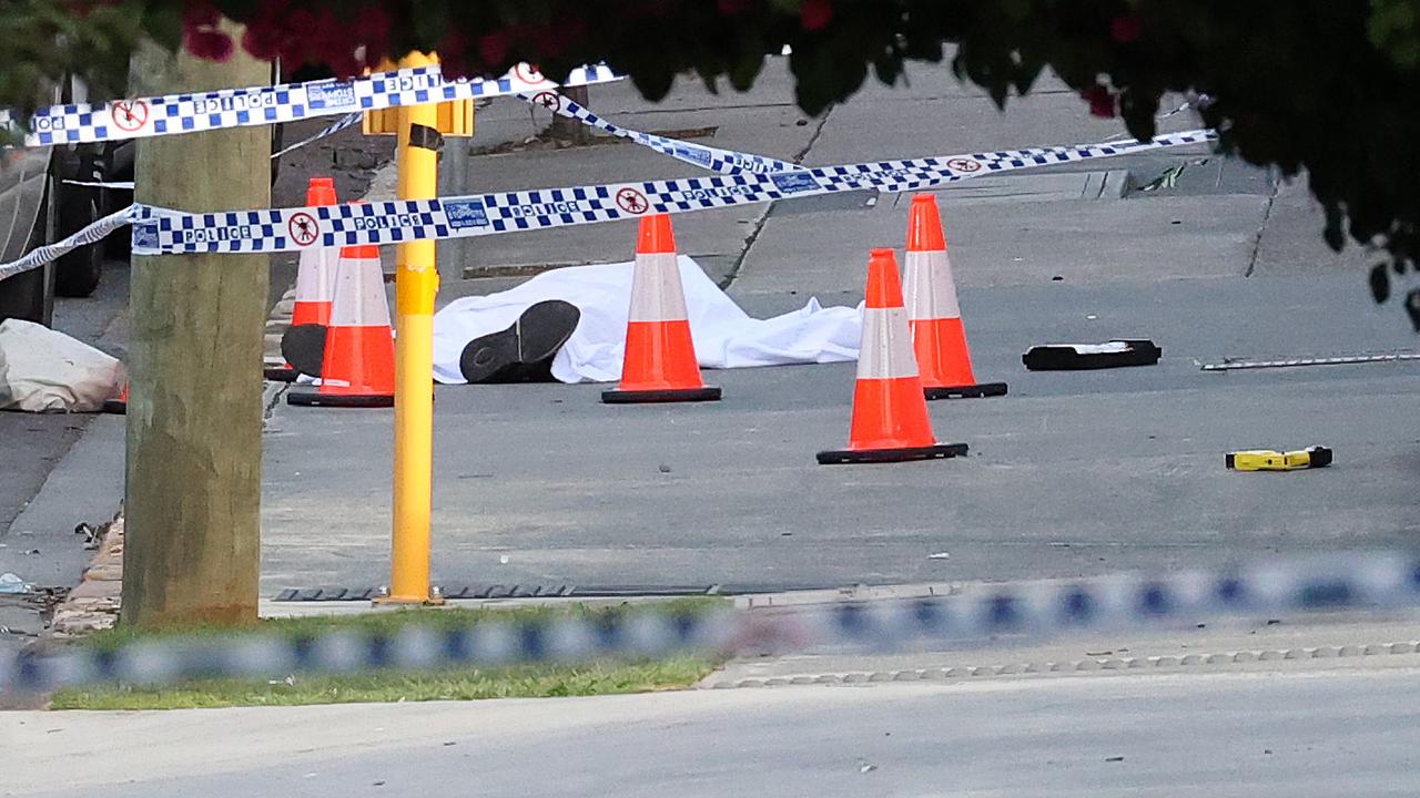 A police taser and a covered body on the sidewalk, The scene of a shooting on Edmondstone Street, South Brisbane. Picture: Liam Kidston