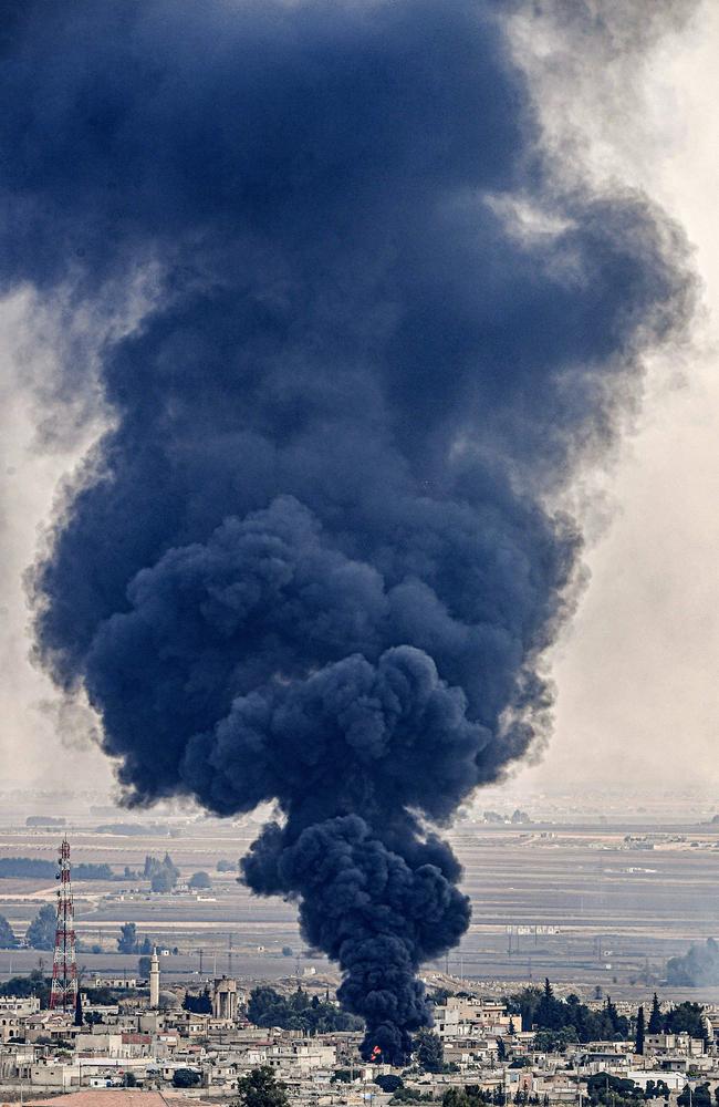 Smoke rising from the Syrian town of Ras al-Ain on the eighth day of Turkey's military operation against Kurdish forces. Picture: AFP