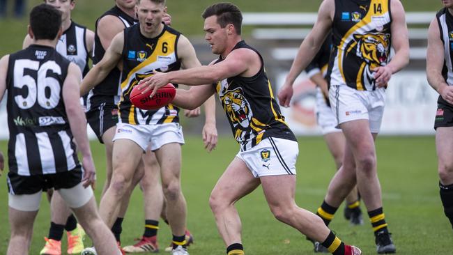 TIGER KING: Kieran Lovell wins one of his 13 clearances against Glenorchy in round 10 of the TSL. Picture: LUKE BOWDEN