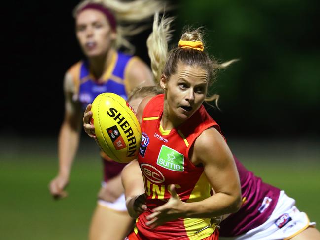 Kate Surman runs the ball during a practice match between AFLW teams the Brisbane Lions and Gold Coast Suns at Leyshon Park on January 29, 2020 in Brisbane, Australia. (Photo by Chris Hyde/Getty Images)