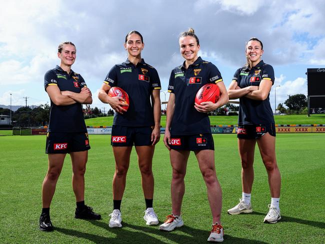 The Hawthorn Hawks AFL Women's team will play a game in Cairns for a second season, when they take on the Melbourne Demons at Cazalys Stadium on October 24. Hawks players Greta Bodey, Mattea Breed, Emily Bates and Casey Sherriff are looking forward to playing in front of a large and enthusiastic Far North Queensland crowd. Picture: Brendan Radke