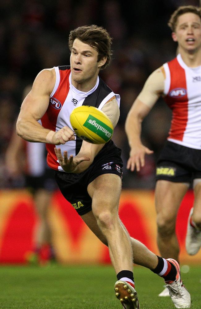 Nathan Freeman shoots out a handball during his AFL debut.