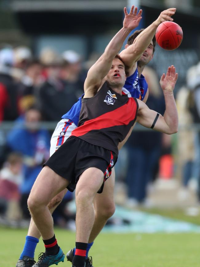 Waaia’s Brayden Coates has his marking attempt spoiled.