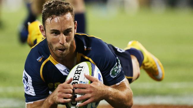 CANBERRA, AUSTRALIA - FEBRUARY 13: Nic White of the Brumbies scores a try during the round one Super Rugby match between the Brumbies and the Reds at GIO Stadium on February 13, 2015 in Canberra, Australia. (Photo by Stefan Postles/Getty Images)