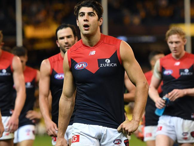 Christian Petracca of the Demons (centre) is seen after the Round 4 AFL match between the Hawthorn Hawks and the Melbourne Demons at the MCG in Melbourne, Sunday, April 15, 2018. (AAP Image/Julian Smith) NO ARCHIVING, EDITORIAL USE ONLY