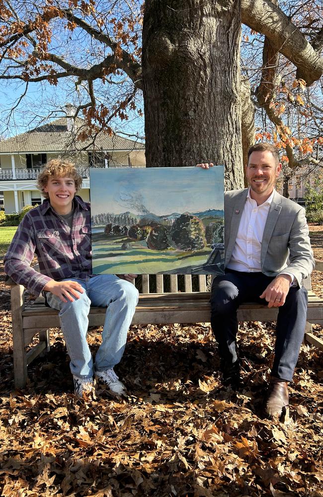 Former Oxley College student Joe Quilty with the artwork he painted as a thank you for his history teacher Justin Verco.