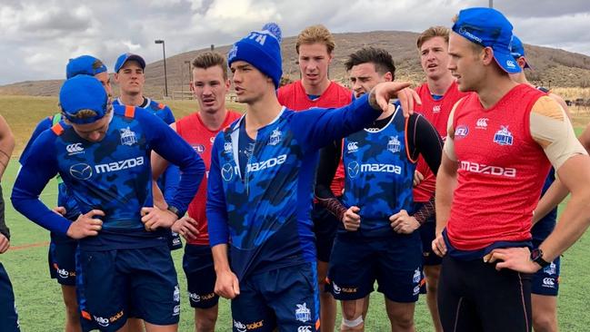 November 2017, North Melbourne's pre-season camp in Utah: Jy Simpkin instructs his young teammates at training. Picture: North Melbourne FC