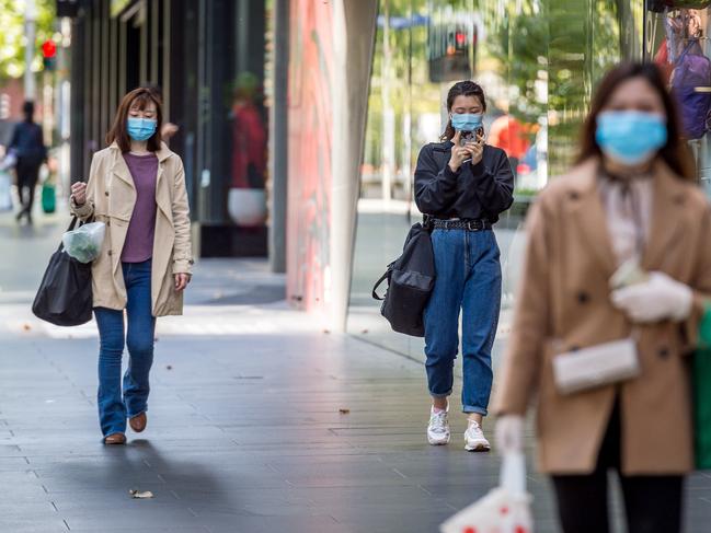 Corona Virus. Melbourne CBD amid stage 2 restrictions. People wear masks during outings in the city. Picture: Jake Nowakowski