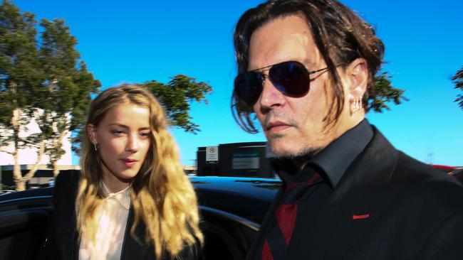 Johnny Depp with Amber Heard outside a Gold Coast court. Picture: AFP