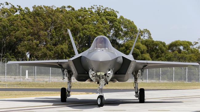 A new F-35A Joint Strike Fighter taxis to it's hanger at Williamtown RAAF base, Monday, December 10, 2018. The Minister for Defence, the Hon Christopher Pyne MP officially welcomed Australia's first two F-35A Joint Strike Fighter aircraft to the RAAF Base Williamtown. (AAP Image/Darren Pateman) NO ARCHIVING