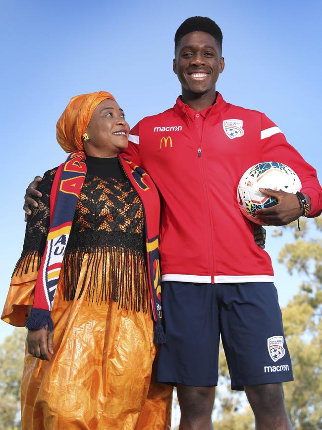 Adelaide United’s Al Hassan Toure, pictured with Mum Mawa, arrived in Australia from Guinea aged four, after his parents fled war-torn Liberia. Picture Dean Martin