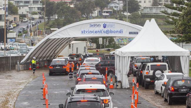 Cars wait in line at a Bondi Beach COVID-19 drive-through testing clinic. Picture: Getty Images