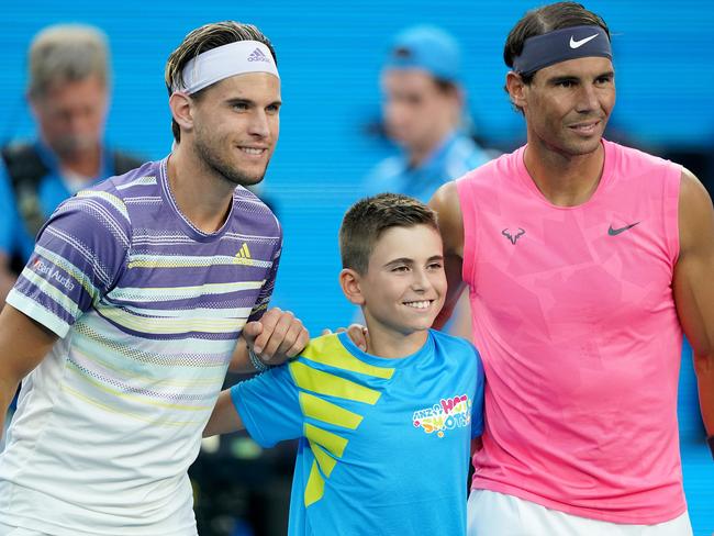 Dominic Thiem of Austria and Rafael Nadal of Spain pose for a photograph following the coin toss ahead of their fifth round match on day 10 of the Australian Open tennis tournament at Rod Laver Arena in Melbourne, Wednesday, January 29, 2020. (AAP Image/Michael Dodge) NO ARCHIVING, EDITORIAL USE ONLY