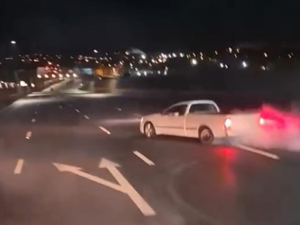 A white ute hooning on Brisbane’s M1 Gateway Motorway