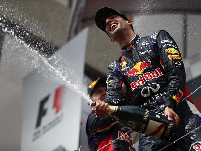 Racewinner Daniel Ricciardo of Australia and Infiniti Red Bull Racing is sprayed with champagne by teammate Sebastian Vettel of Germany and Infiniti Red Bull Racing following his victory during the Canadian Formula One Grand Prix at Circuit Gilles Villeneuve on June 8, 2014 in Montreal, Canada. Picture: Andrew Hone/Getty Images