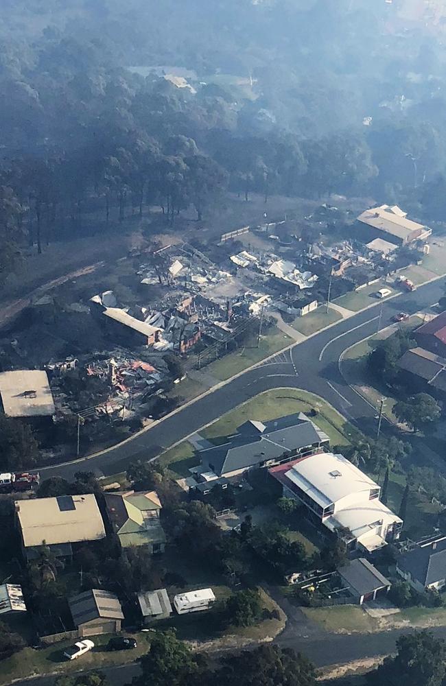 Razed ... A street of destroyed homes in Tathra today. Picture: Phillip O'Driscoll