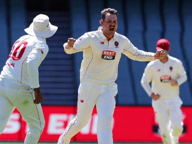 ADELAIDE, AUSTRALIA - FEBRUARY 21: Ben Manenti of South Australia celebrates the wicket of Nivethan Radhakrishnan of Tasmania for 68 runs - caught Nathan McSweeney of South Australia  during the Sheffield Shield match between South Australia and Tasmania at Adelaide Oval, on February 21, 2025, in Adelaide, Australia. (Photo by Sarah Reed/Getty Images)