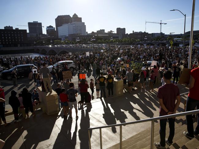 People gather for a peaceful rally in support of George Floyd in front of the police station in Des Moines, Iowa. Picture: Brian Powers/The Des Moines Register via AP