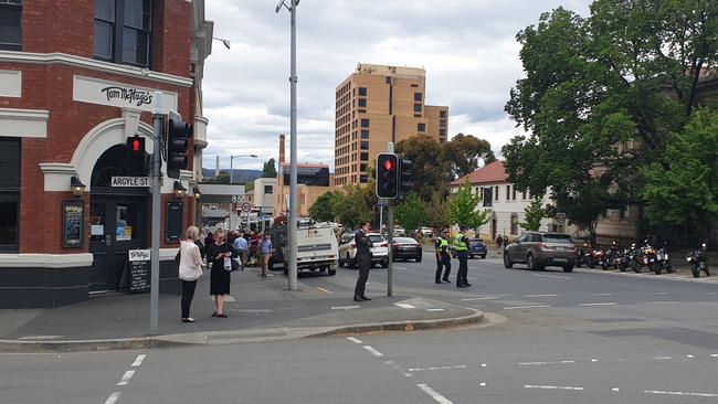 Tasmania Fire is investigating a fire alarm at an apartment block in Macquarie Street, Hobart, that's affecting traffic. Photo: Zak Simmonds