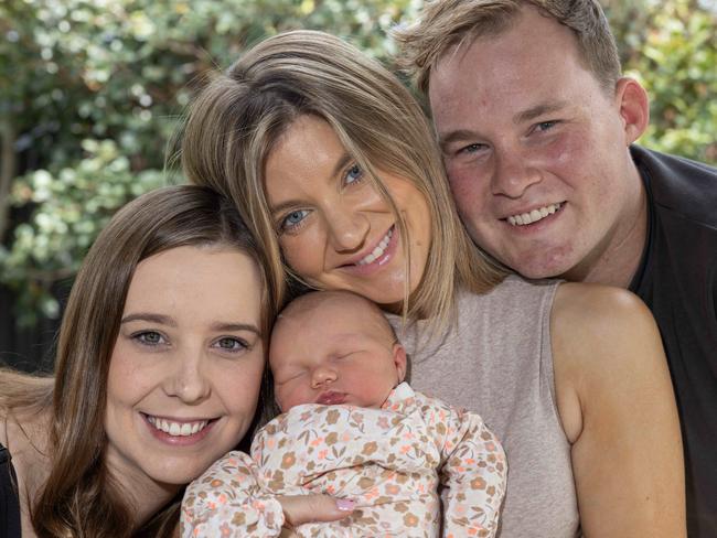 Surrogate Emily with Sarah and Tom Starkey and new baby Savannah Emily-Joan Starkey at their home. Picture: Kelly Barnes