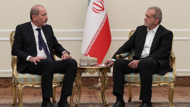 Iranian president Masoud Pezeshkian (R) meets Jordan's foreign minister Ayman Safadi in Tehran. Picture: AFP.