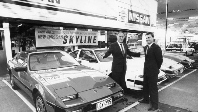 Car dealers Ken Eustice and Andrew Eustice with luxury sports cars for sale. Picture: 1986.